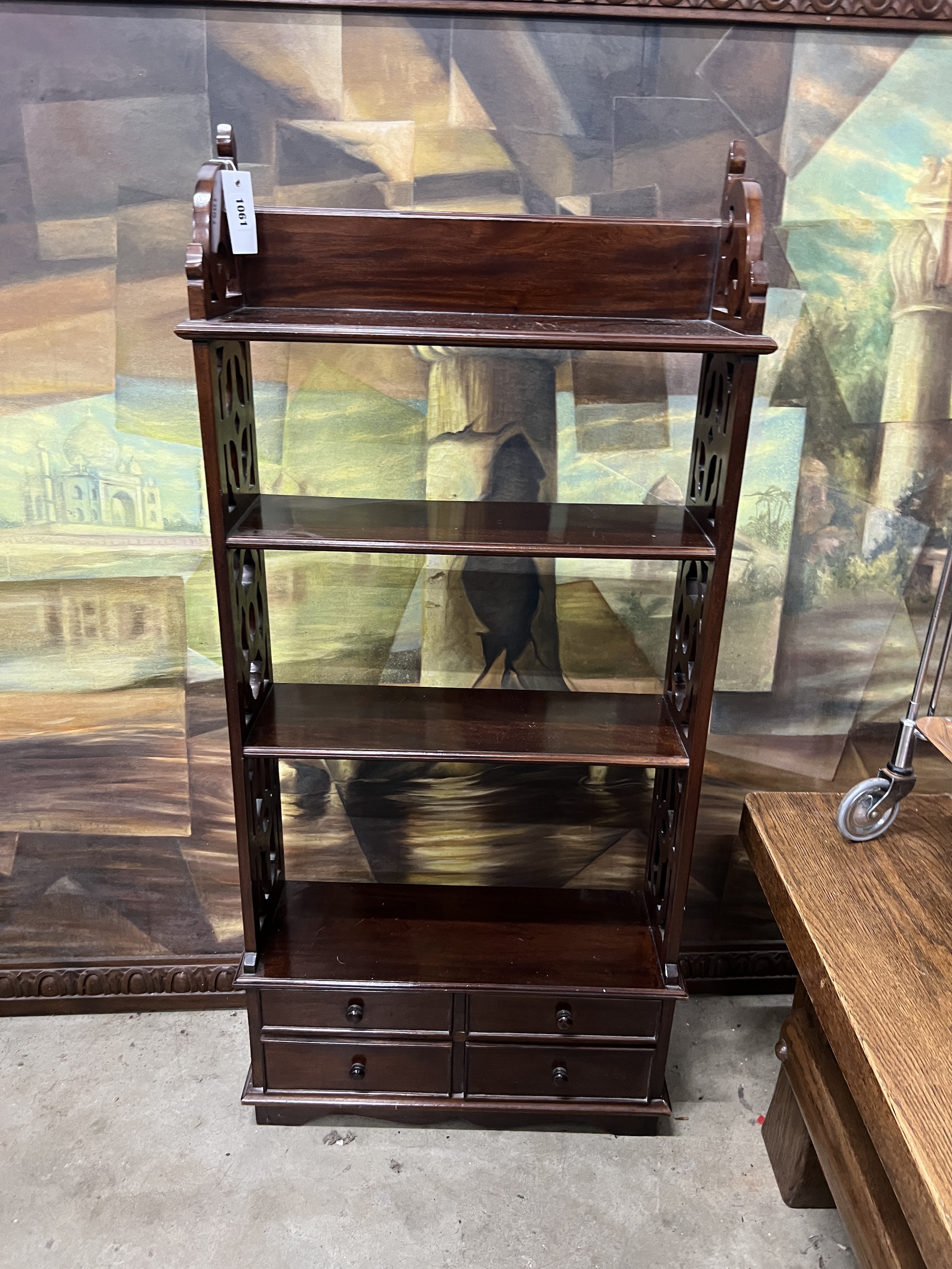 A reproduction George III style mahogany open bookcase, width 52cm, depth 17cm, height 113cm